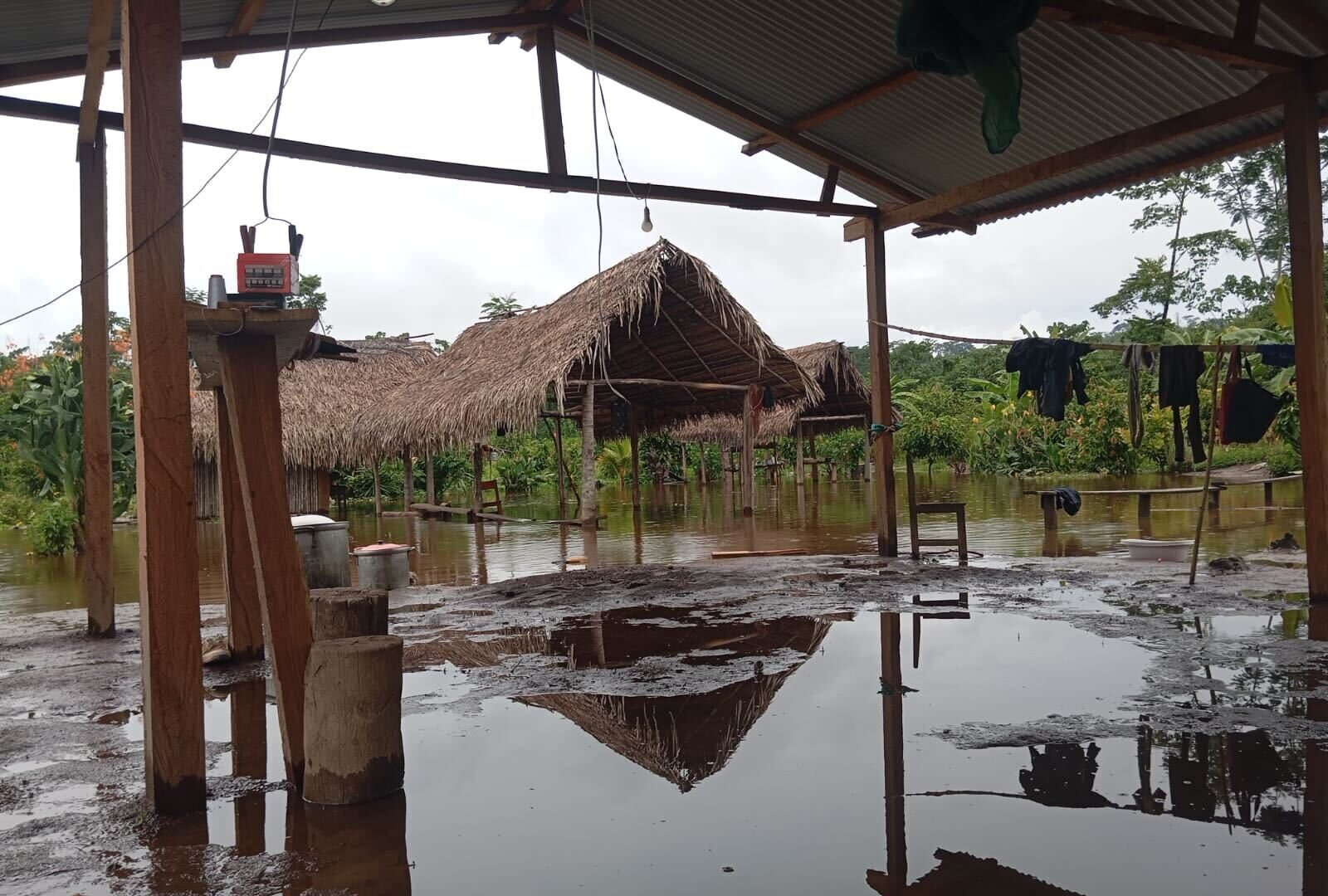 Images show the early effects of flooding on Ashaninka communities in the Amazon rainforest.